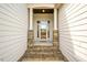 Inviting front entrance with stone pillars and natural stone walkway at 2910 Reynolda Cir, Durham, NC 27712