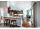 Bright kitchen boasts granite counters, stainless appliances, breakfast bar, and adjacent dining area at 2910 Reynolda Cir, Durham, NC 27712