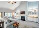 Spacious living room with a fireplace, built-in shelves and high ceilings at 2910 Reynolda Cir, Durham, NC 27712