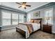 Serene main bedroom features natural light, ceiling fan, and plush carpet at 2910 Reynolda Cir, Durham, NC 27712