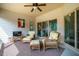 Inviting screened porch features comfortable wicker seating and a ceiling fan for relaxation at 2910 Reynolda Cir, Durham, NC 27712
