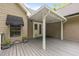 Covered back deck with plank flooring provides ample space for seating and entertaining at 2917 Kesler Trl, Mebane, NC 27302