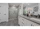 Bathroom boasts a double sink vanity, white cabinets, tile flooring, and a tiled shower at 2917 Kesler Trl, Mebane, NC 27302