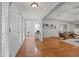 Bright entryway with gleaming hardwood floors and views into the living spaces at 2917 Kesler Trl, Mebane, NC 27302