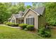 Tan home offers dark shutters, dormers, and mature landscaping at 2917 Kesler Trl, Mebane, NC 27302