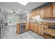 Kitchen with stainless steel appliances, granite countertops and a door that leads to a deck at 2917 Kesler Trl, Mebane, NC 27302