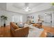 Open living room provides hardwood floors, neutral paint, a fireplace, and stylish furnishings at 2917 Kesler Trl, Mebane, NC 27302