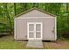 Exterior of outbuilding with double doors and ramp access, providing extra storage space at 2917 Kesler Trl, Mebane, NC 27302