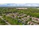 An aerial view showcases a neighborhood surrounded by lush trees, and manicured lawns at 3027 Maple Ave # M2, Burlington, NC 27215