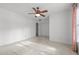 This airy bedroom offers carpeted floors and a ceiling fan at 3027 Maple Ave # M2, Burlington, NC 27215