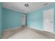 This is a bedroom with carpeted floors, neutral walls, and a standard closet, presenting a blank canvas for personalization at 3027 Maple Ave # M2, Burlington, NC 27215