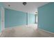This bedroom has carpeted floors, a neutral color scheme, and a large window that allows natural light into the space at 3027 Maple Ave # M2, Burlington, NC 27215