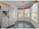 Eat-in kitchen with breakfast nook, stainless fridge, and lots of light at 3027 Maple Ave # M2, Burlington, NC 27215