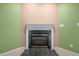 Living room with a fireplace, offering a cozy focal point in a spacious area, perfect for gatherings and relaxation at 3027 Maple Ave # M2, Burlington, NC 27215