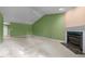 Living room with a vaulted ceiling, carpeted floors, a fireplace, and good lighting, creating a warm and inviting space at 3027 Maple Ave # M2, Burlington, NC 27215