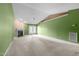 An open living area offers a fireplace, ceiling fan, access to the outside through patio doors, and ample natural light at 3027 Maple Ave # M2, Burlington, NC 27215