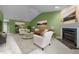 Staged living room with vaulted ceilings, a ceiling fan, plush carpeting, and a fireplace at 3027 Maple Ave # M2, Burlington, NC 27215