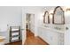 Elegant bathroom with double vanity, stylish mirrors, and modern fixtures at 3028 Rothgeb Dr, Raleigh, NC 27609