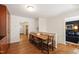 Traditional dining room with hardwood floors, and a view into the living room at 3028 Rothgeb Dr, Raleigh, NC 27609