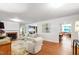 Spacious living room with hardwood floors, fireplace, and ample natural light at 3028 Rothgeb Dr, Raleigh, NC 27609