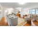 Large open living room with hardwood floors and comfortable seating at 3028 Rothgeb Dr, Raleigh, NC 27609