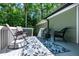 Inviting back deck with stylish outdoor seating and a decorative rug, perfect for relaxation at 305 Monterey Ct, Benson, NC 27504