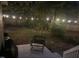 Backyard with chair, lights, and a wooden fence at 305 Monterey Ct, Benson, NC 27504