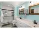 Modern bathroom with double vanity, framed mirrors, and a black-trimmed glass shower at 305 Monterey Ct, Benson, NC 27504