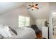 Comfortable bedroom with a plush bed, hardwood floors, ceiling fan and natural lighting at 305 Monterey Ct, Benson, NC 27504