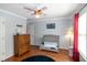 Bedroom with a crib, wooden dresser, baseball decor, ceiling fan and hardwood floors at 305 Monterey Ct, Benson, NC 27504