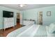 Spacious bedroom with hardwood floors, multiple dressers, and natural lighting at 305 Monterey Ct, Benson, NC 27504