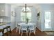 Charming dining area with vaulted ceilings and a modern chandelier at 305 Monterey Ct, Benson, NC 27504
