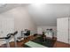 The exercise area includes a treadmill, weight bench, desk, and hardwood floors at 305 Monterey Ct, Benson, NC 27504