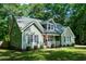 Attractive home with manicured front lawn, complemented by lush landscaping and trees at 305 Monterey Ct, Benson, NC 27504
