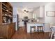 Kitchen featuring white cabinets, stainless steel appliances, and a breakfast bar at 305 Monterey Ct, Benson, NC 27504