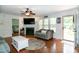 Cozy living room with a fireplace, TV, and a view of the backyard at 305 Monterey Ct, Benson, NC 27504
