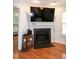 Living room featuring fireplace and TV on mantle at 305 Monterey Ct, Benson, NC 27504