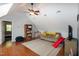 Spacious living room with hardwood floors, ceiling fan and comfortable seating at 305 Monterey Ct, Benson, NC 27504