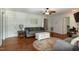 Inviting living room featuring hardwood floors, a ceiling fan, and comfortable seating arrangement at 305 Monterey Ct, Benson, NC 27504