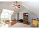 Bright playroom with hardwood floors, ceiling fan and a table for activities at 305 Monterey Ct, Benson, NC 27504