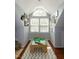 A sunny playroom featuring a train table with hardwood floors and a chevron rug at 305 Monterey Ct, Benson, NC 27504