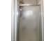 Shower with frosted glass and silver trim at 305 Monterey Ct, Benson, NC 27504