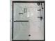 Sleek bathroom shower featuring a glass door, black fixtures, and shelving at 305 Monterey Ct, Benson, NC 27504