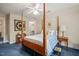 This bedroom boasts a four poster bed, a walk in closet and comfortable accommodations at 3201 Keighley Forest Dr, Wake Forest, NC 27587