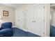 Hallway view highlights two double closets, offering ample storage space; blue carpet adds color at 3201 Keighley Forest Dr, Wake Forest, NC 27587