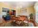 Cozy dining room featuring a wooden table with seating for six and yellow wallpaper at 3201 Keighley Forest Dr, Wake Forest, NC 27587