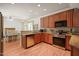Well-lit kitchen boasts stainless steel appliances and light granite countertops at 3201 Keighley Forest Dr, Wake Forest, NC 27587