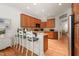 Spacious kitchen with a breakfast bar, recessed lighting, and wood cabinetry at 3201 Keighley Forest Dr, Wake Forest, NC 27587
