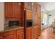 Kitchen features wood cabinets, granite countertops, and a built-in refrigerator at 3201 Keighley Forest Dr, Wake Forest, NC 27587