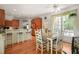 Bright eat-in kitchen featuring wood cabinets, breakfast bar, and cozy dining area at 3201 Keighley Forest Dr, Wake Forest, NC 27587